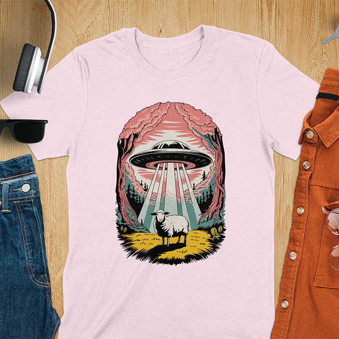 A t-shirt with a UFO hovering over a sheep in a forest scene. This alien tshirt depicts ufo alien abductions with a cute sheep. A weird shirt and funny alien gift, one of those oddly specific tees. A graphic tee-shirt with a 90s graphic tee style. A farm animal gifts or animal person gift. A farmer t shirt or farming shirt, a mom gift alternative.