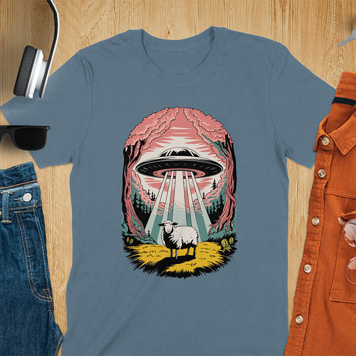 A t-shirt with a UFO hovering over a sheep in a forest scene. This alien tshirt depicts ufo alien abductions with a cute sheep. A weird shirt and funny alien gift, one of those oddly specific tees. A graphic tee-shirt with a 90s graphic tee style. A farm animal gifts or animal person gift. A farmer t shirt or farming shirt, a mom gift alternative.