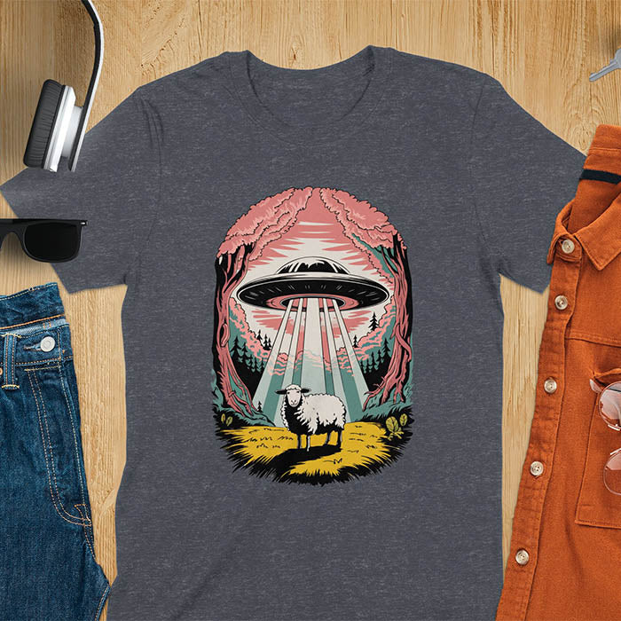 A t-shirt with a UFO hovering over a sheep in a forest scene. This alien tshirt depicts ufo alien abductions with a cute sheep. A weird shirt and funny alien gift, one of those oddly specific tees. A graphic tee-shirt with a 90s graphic tee style. A farm animal gifts or animal person gift. A farmer t shirt or farming shirt, a mom gift alternative.
