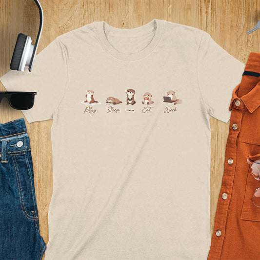 cute funny otters in a row side by side doing daily activities, play, sleep, eat, work, except for one which just stares blankly at you and a ..... is used to describe it. kawaii river otters tee-shirt