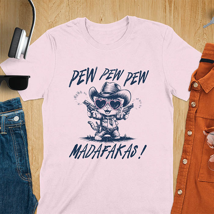 A t-shirt with a cat in a cowboy outfit wearing heart sunglasses and holding two pistols. Text: "PEW PEW PEW" above and "MADAFAKAS!" below. This funny meme t shirt features a funny cowboy cat with a sarcastic quote. A funny genz meme and sarcastic meme shirt, a snarky humorous funny adult joke. An animal person gift or gift for mom, a sassy quote funny funny fuck gift.