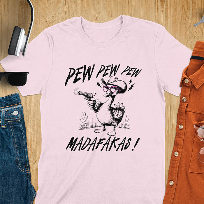 A t-shirt with a goose wearing a cowboy hat and sunglasses, holding a pistol. Text: "PEW PEW PEW" above and "MADAFAKAS!" below. This funny meme shirt features a silly funny goose with a sarcastic quote. A funny genz meme and sarcastic meme shirt, a snarky humorous funny adult joke. An animal person gift or goose lovers gift, a sassy quote funny funny fuck gift. A mom Gift alternative.