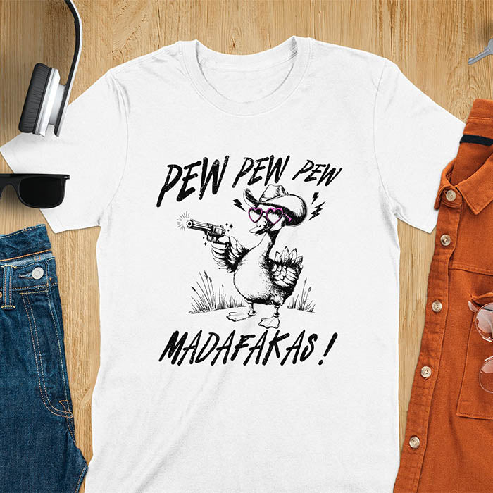A t-shirt with a goose wearing a cowboy hat and sunglasses, holding a pistol. Text: "PEW PEW PEW" above and "MADAFAKAS!" below. This funny meme shirt features a silly funny goose with a sarcastic quote. A funny genz meme and sarcastic meme shirt, a snarky humorous funny adult joke. An animal person gift or goose lovers gift, a sassy quote funny funny fuck gift. A mom Gift alternative.