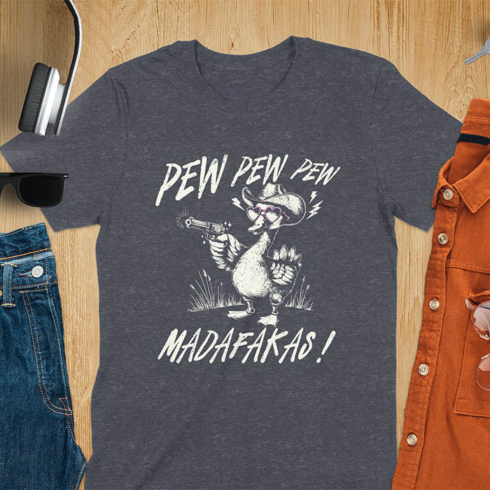 A t-shirt with a goose wearing a cowboy hat and sunglasses, holding a pistol. Text: "PEW PEW PEW" above and "MADAFAKAS!" below. This funny meme shirt features a silly funny goose with a sarcastic quote. A funny genz meme and sarcastic meme shirt, a snarky humorous funny adult joke. An animal person gift or goose lovers gift, a sassy quote funny funny fuck gift. A mom Gift alternative.
