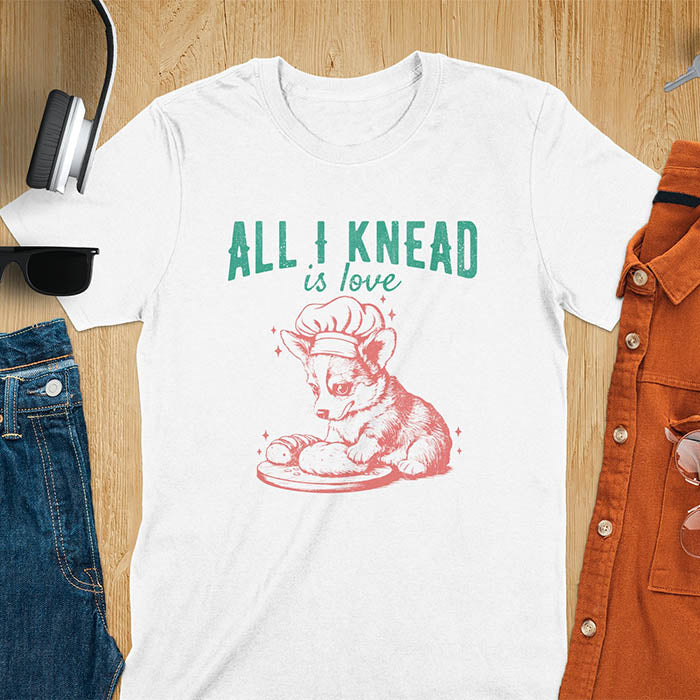 White t-shirt with a cute Corgi puppy wearing chef hat kneading dough on funny baking tee