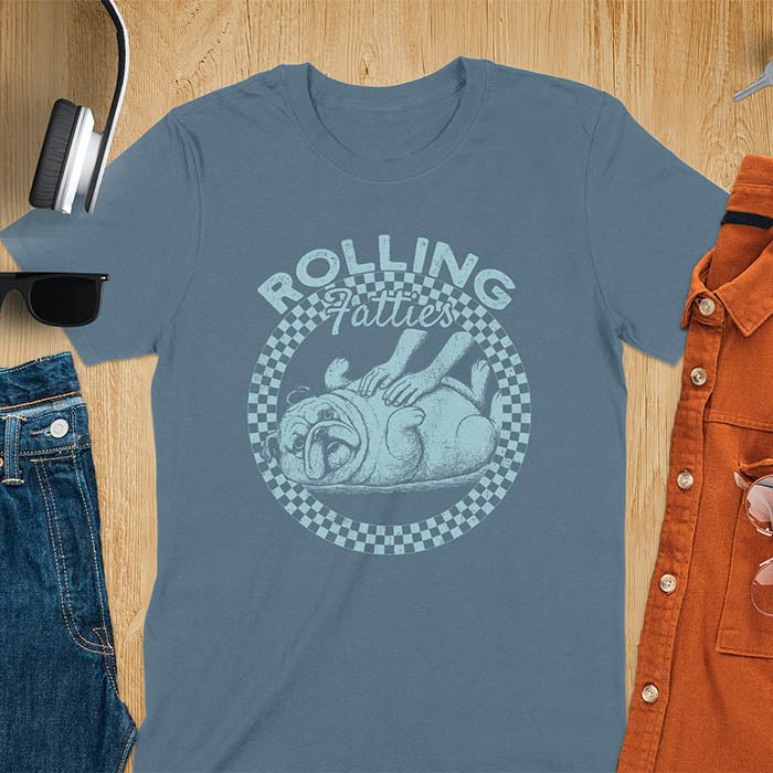 Indigo blue colored unisex t-shirt featuring 'Rolling Fatties' text in blue lettering above a cute chubby bulldog lying on its back within a blue and white checkered circle border