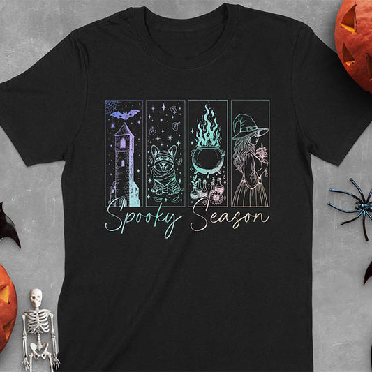 Black t-shirt featuring four neon panels with haunted house, mummy corgi, bubbling cauldron, and witch figure, with 'Spooky Season' text below
