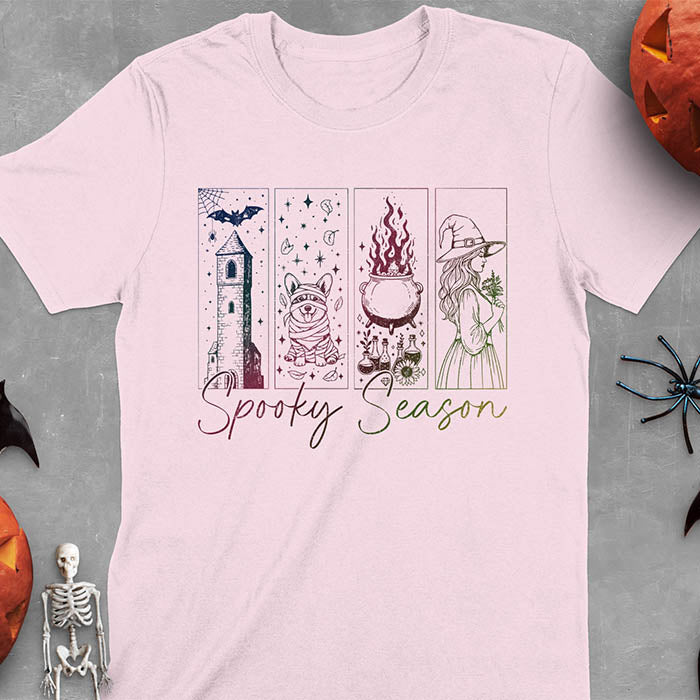 Light Pink t-shirt featuring four ombre color panels with haunted house, mummy corgi, bubbling cauldron, and witch figure, with 'Spooky Season' text below