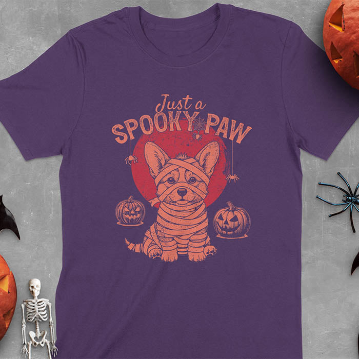 Purple t-shirt with Halloween mummy corgi featuring "Just a Spooky Paw" text and wrapped corgi graphics