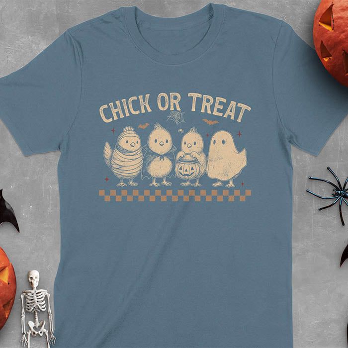 Indigo Blue t-shirt with Funny Halloween Chick Or Treat text featuring cartoon chickens dressed as spooky characters including ghost, mummy, vampire, and trick-or-treater