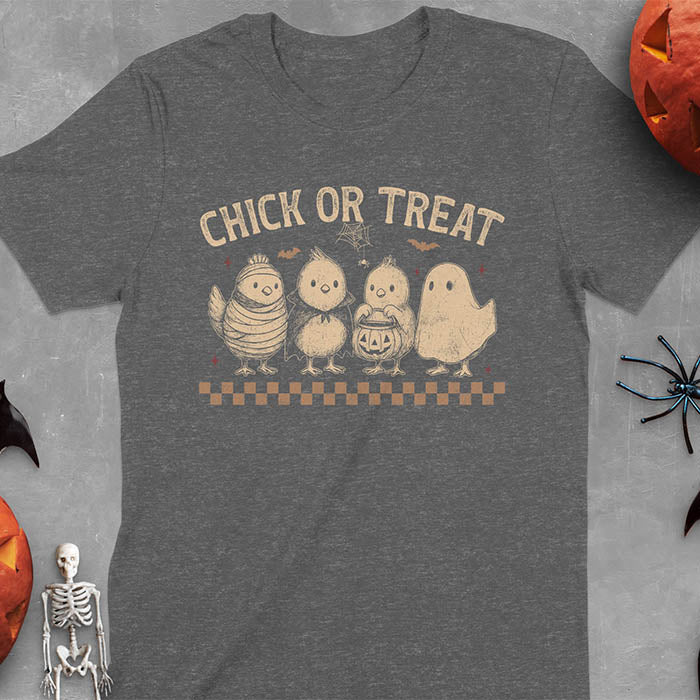 Dark heather t-shirt with Funny Halloween Chick Or Treat text featuring cartoon chickens dressed as spooky characters including ghost, mummy, vampire, and trick-or-treater