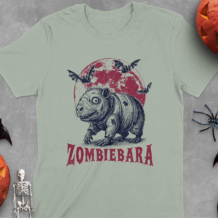 Sage green t-shirt Halloween zombie capybara featuring ZOMBIEBARA design with blood moon and bats