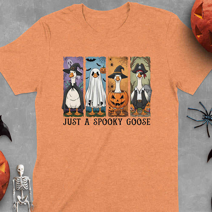 Heather Orange Halloween Just a Spooky Goose t-shirt featuring ghost, pumpkin, witch, and pirate goose designs