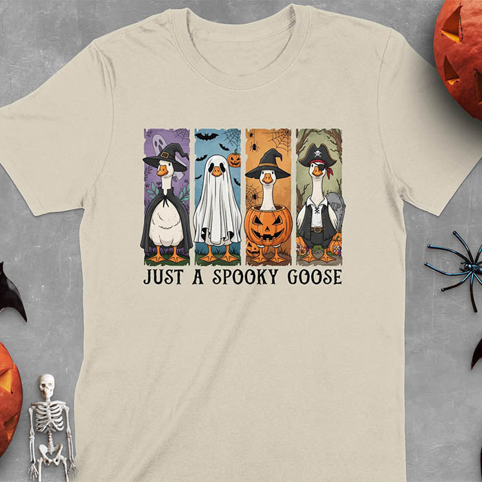Sand color Halloween Just a Spooky Goose t-shirt featuring ghost, pumpkin, witch, and pirate goose designs