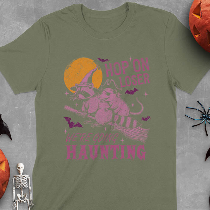 Military green Halloween witch raccoon and opossum t-shirt with flying broom animal graphics