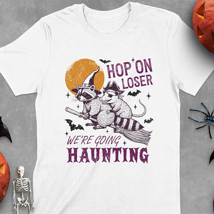 White Halloween witch raccoon and opossum t-shirt with flying broom animal graphics