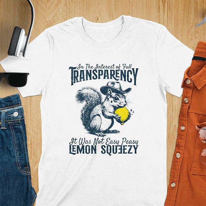 White t-shirt featuring illustrated squirrel wearing cowboy hat and holding yellow lemon with text 'In The Interest of Full Transparency It Was Not Easy Peasy Lemon Squeezy' - funny sarcastic meme design