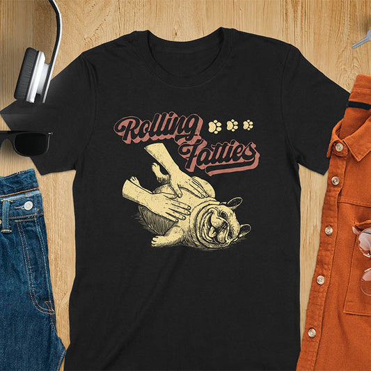 Black t-shirt with Rolling Fatties script text and French Bulldog being petted by human hands in line drawing style.