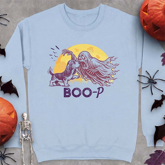 Light Blue sweatshirt with a Halloween graphic of a Basset Hound puppy booping a screaming ghost's nose as it reaches out with a skeletal hand with bats flying past a glowing moon and the text Boo-P underneath