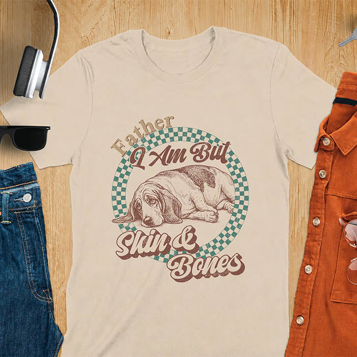 Sand color with Basset Hound graphic, retro checkered design and "Father I Am But Skin And Bones" text