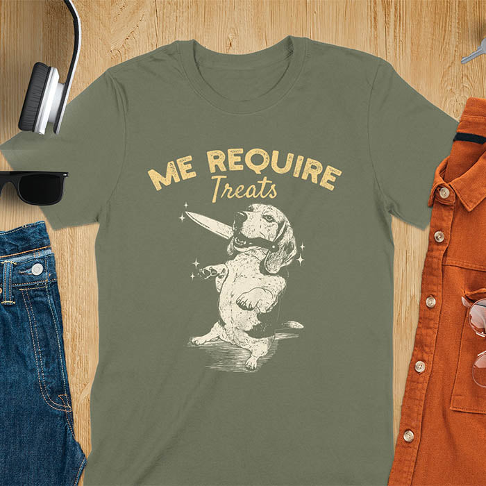 Military Green t-shirt with Me Require Treats text, basset hound meme design, and vintage grumpy dog biting on a knife in its mouth illustration