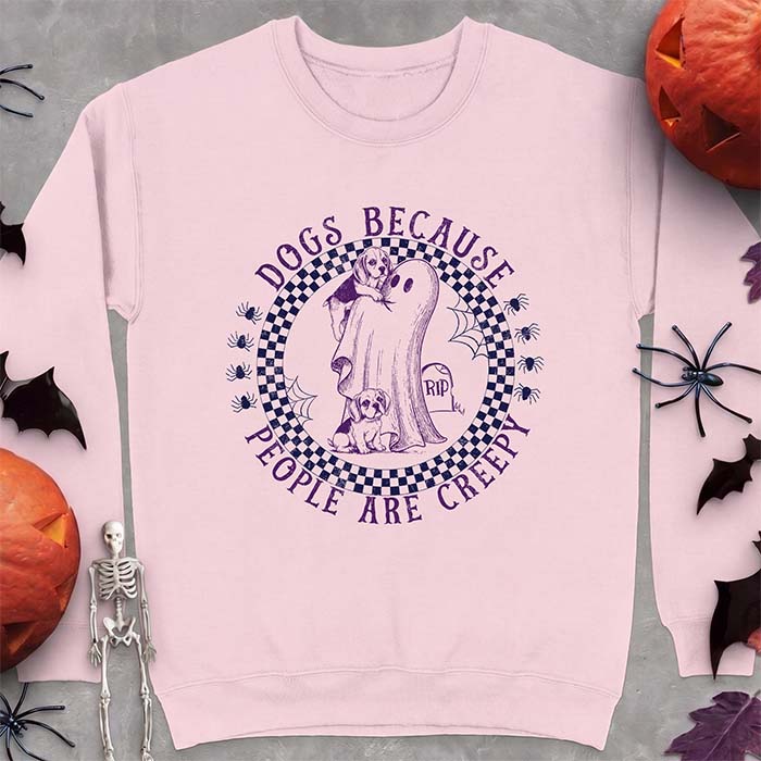 Light Pink sweatshirt with a Halloween graphic of two Beagle puppies peeking around a classic bedsheet ghost inside a checkerboard circle with spiders and cobwebs, and the text Dogs Because People Are Creepy