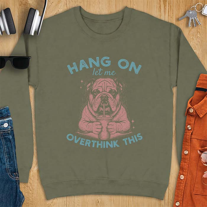Military Green sweatshirt with a graphic of an English Bulldog holding an iced coffee with a straw, with the text Hang On Let Me Overthink This