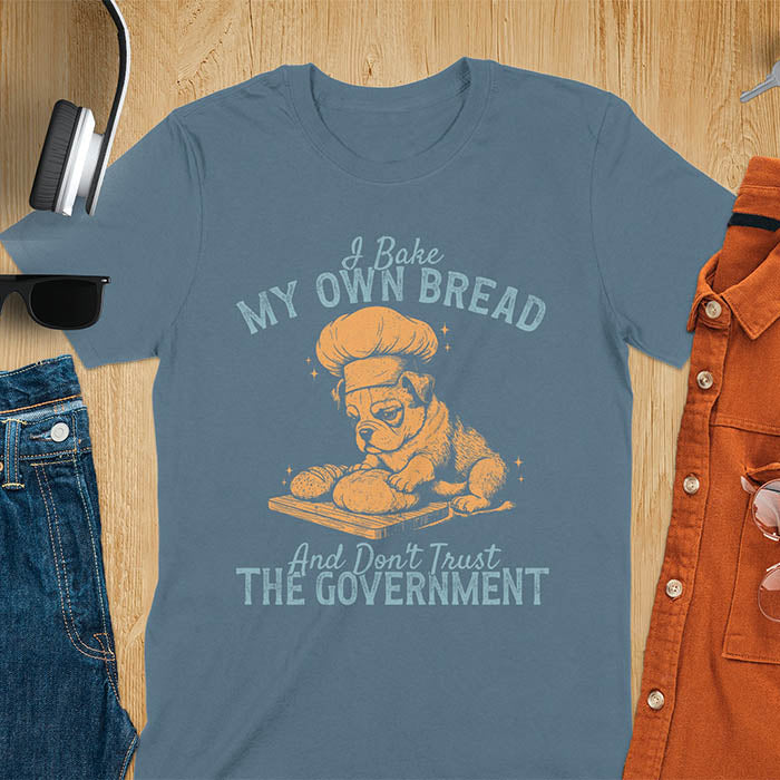 Indigo Blue tee with "I Bake My Own Bread Don't Trust Government" text and vintage bulldog puppy in chef hat kneading bread graphic