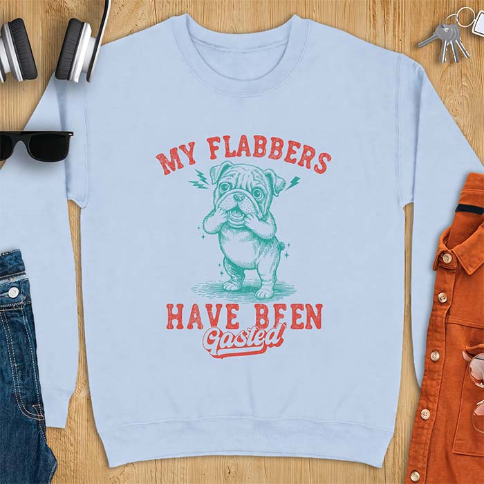 Light Blue sweatshirt with a graphic of an English Bulldog puppy covering its face in shock, lightning bolts crackling by its ears, printed with the text My Flabbers Have Been Gasted.