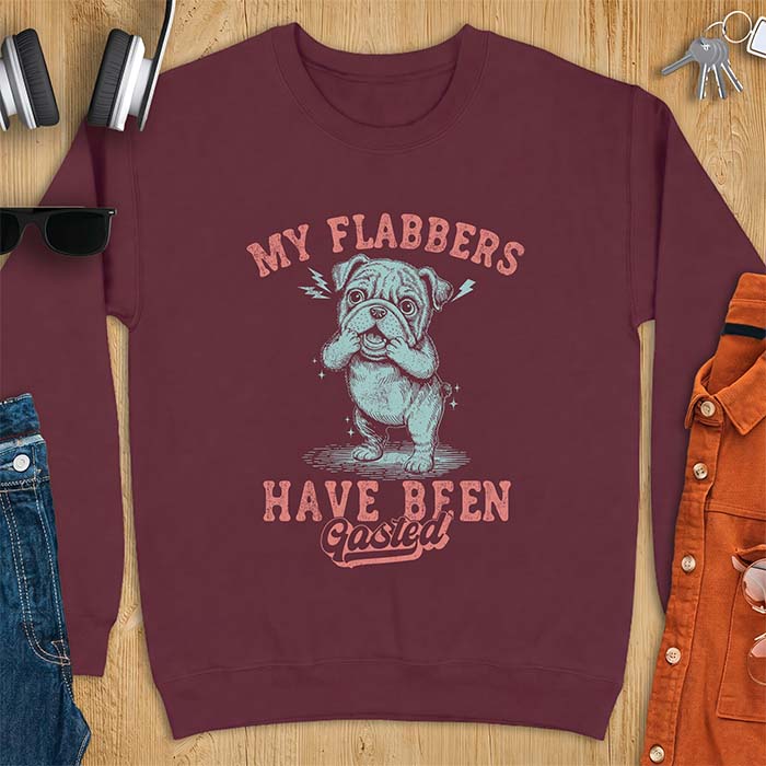 Maroon sweatshirt with a graphic of an English Bulldog puppy covering its face in shock, lightning bolts crackling by its ears, printed with the text My Flabbers Have Been Gasted.