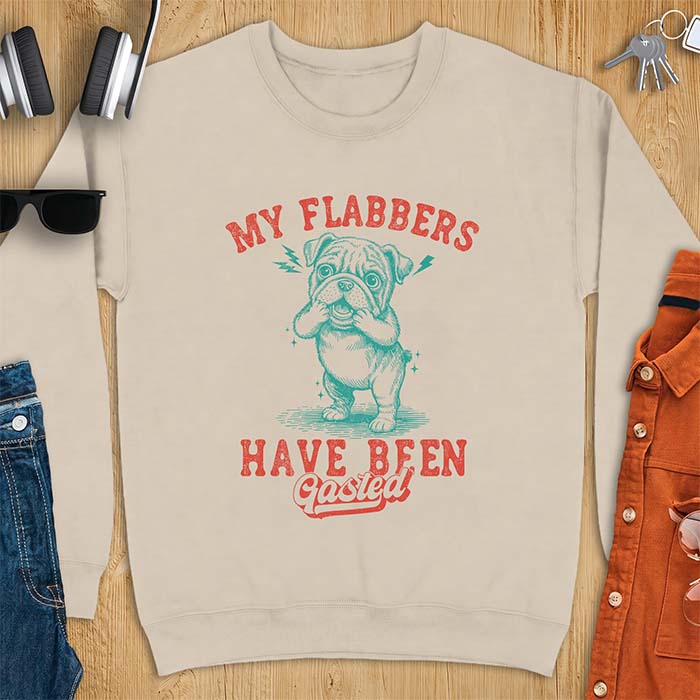 Sand sweatshirt with a graphic of an English Bulldog puppy covering its face in shock, lightning bolts crackling by its ears, printed with the text My Flabbers Have Been Gasted.