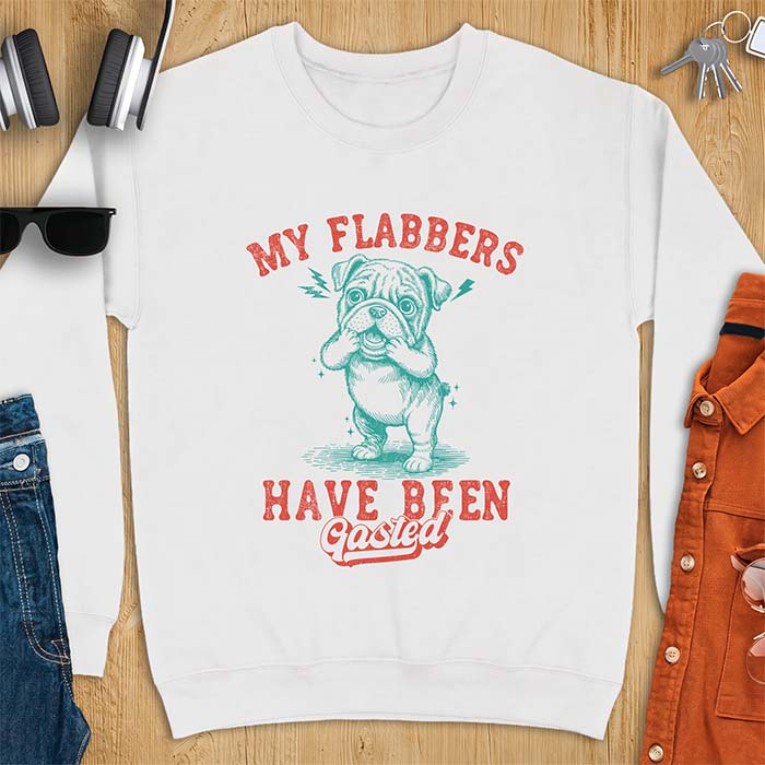 White sweatshirt with a graphic of an English Bulldog puppy covering its face in shock, lightning bolts crackling by its ears, printed with the text My Flabbers Have Been Gasted.