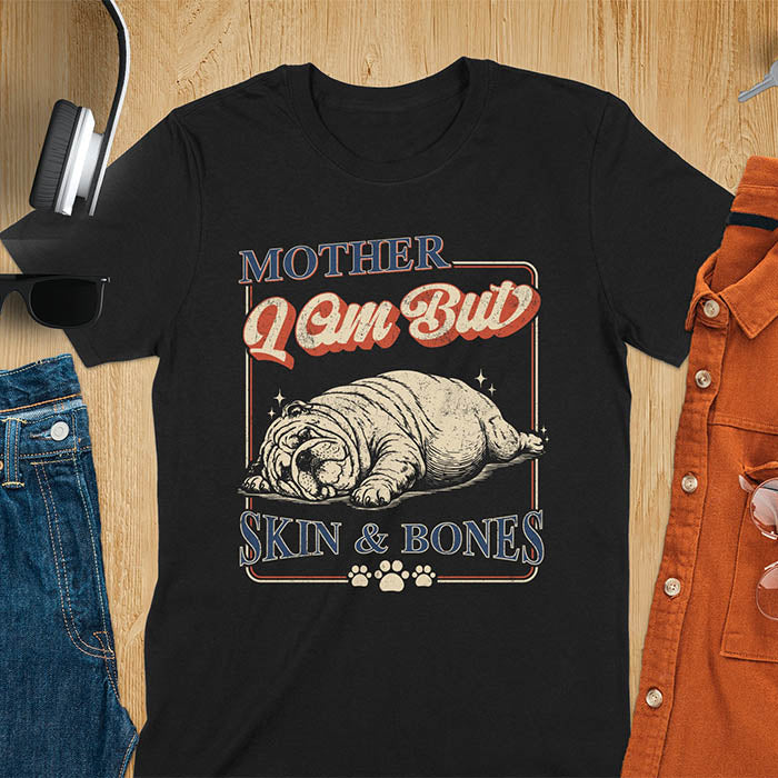 Mother I Am But Skin And Bones text with dramatic sprawled bulldog in pitiful starving pose with vintage retro frame graphic on black t-shirt