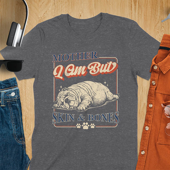 Mother I Am But Skin And Bones text with dramatic sprawled bulldog in pitiful starving pose with vintage retro frame graphic on dark heather t-shirt