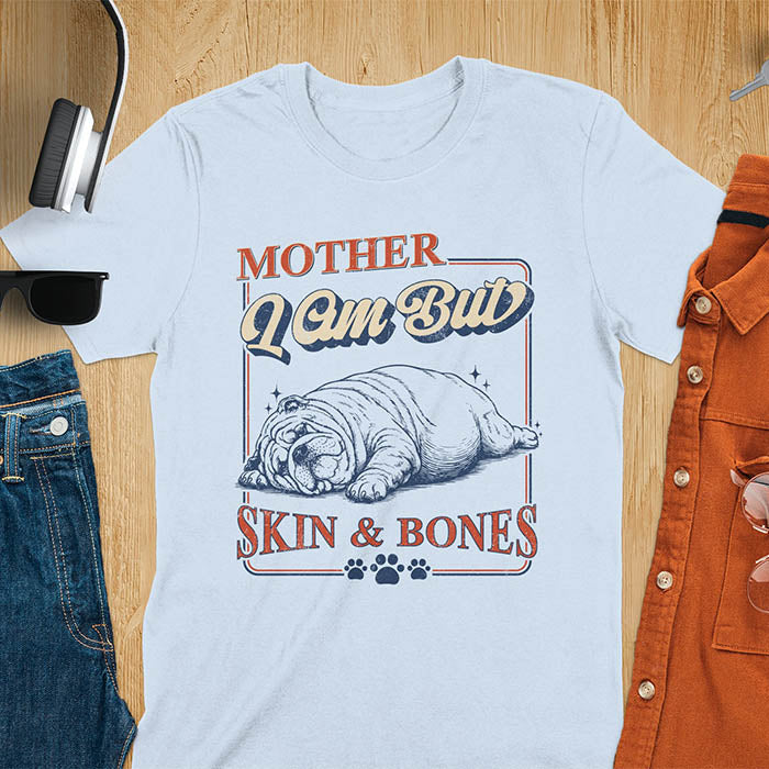 Mother I Am But Skin And Bones text with dramatic sprawled bulldog in pitiful starving pose with vintage retro frame graphic on light blue t-shirt