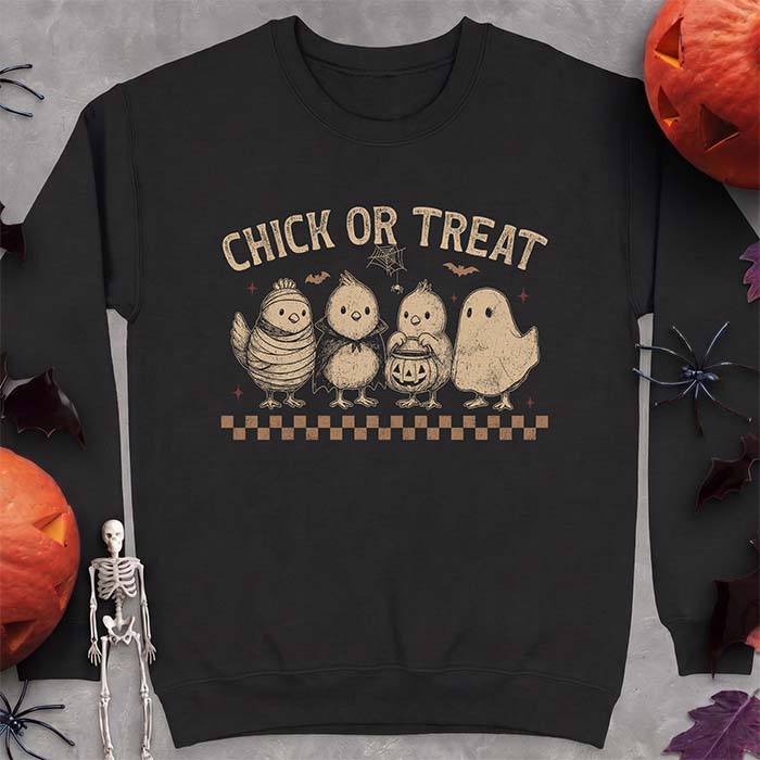 Black sweatshirt with a Halloween graphic of four baby chicks dressed as a mummy, a vampire, a pumpkin bucket trick-or-treater and a ghost, with the text Chick Or Treat