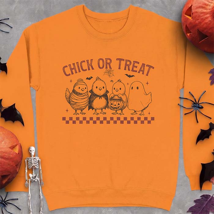 Safety Orange sweatshirt with a Halloween graphic of four baby chicks dressed as a mummy, a vampire, a pumpkin bucket trick-or-treater and a ghost, with the text Chick Or Treat