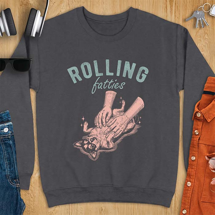 Dark Heather sweatshirt with a graphic of a chubby Chihuahua rolled onto its back getting a two-handed belly rub with tiny sparkles around it, above the text Rolling Fatties