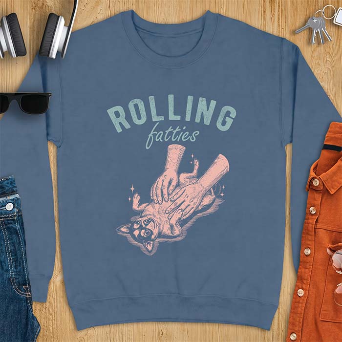 Indigo Blue sweatshirt with a graphic of a chubby Chihuahua rolled onto its back getting a two-handed belly rub with tiny sparkles around it, above the text Rolling Fatties