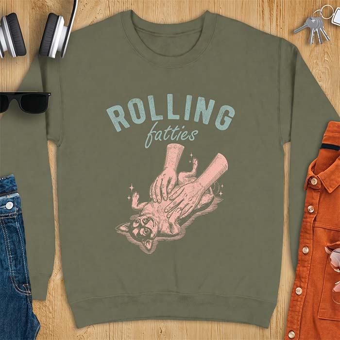Military Green sweatshirt with a graphic of a chubby Chihuahua rolled onto its back getting a two-handed belly rub with tiny sparkles around it, above the text Rolling Fatties