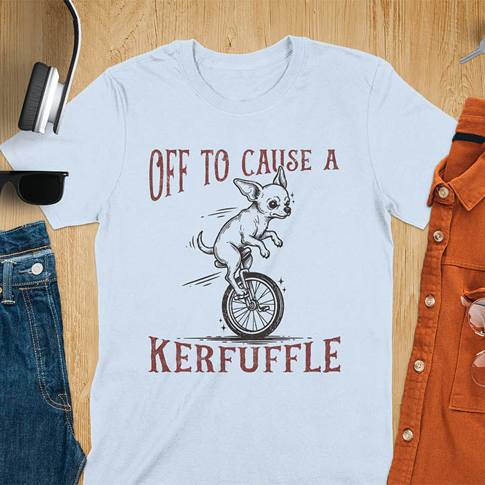 Light blue t-shirt with Chihuahua on unicycle graphic featuring 'Off To Cause A Kerfuffle' text - playful dog meme design