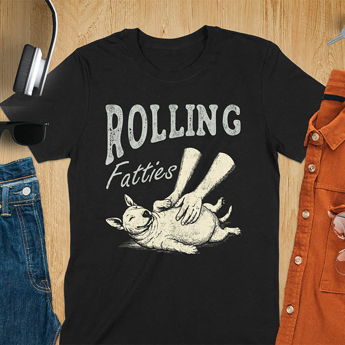 Black t-shirt with chubby Bull Terrier belly rub graphic featuring 'Rolling Fatties' text, funny dog meme design