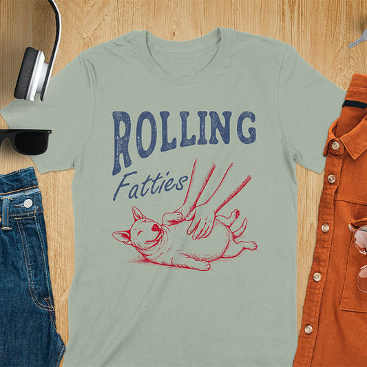 Sage green t-shirt with chubby Bull Terrier belly rub graphic featuring 'Rolling Fatties' text, funny dog meme design