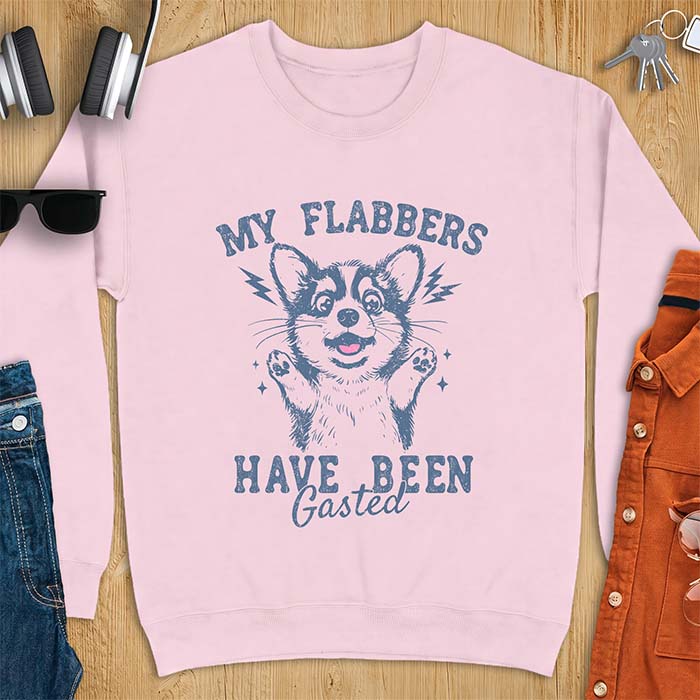 Light Pink sweatshirt with a corgi illustration, paws raised in shock, mouth open in a gasp, lightning bolts beside its ears, and the text My Flabbers Have Been Gasted