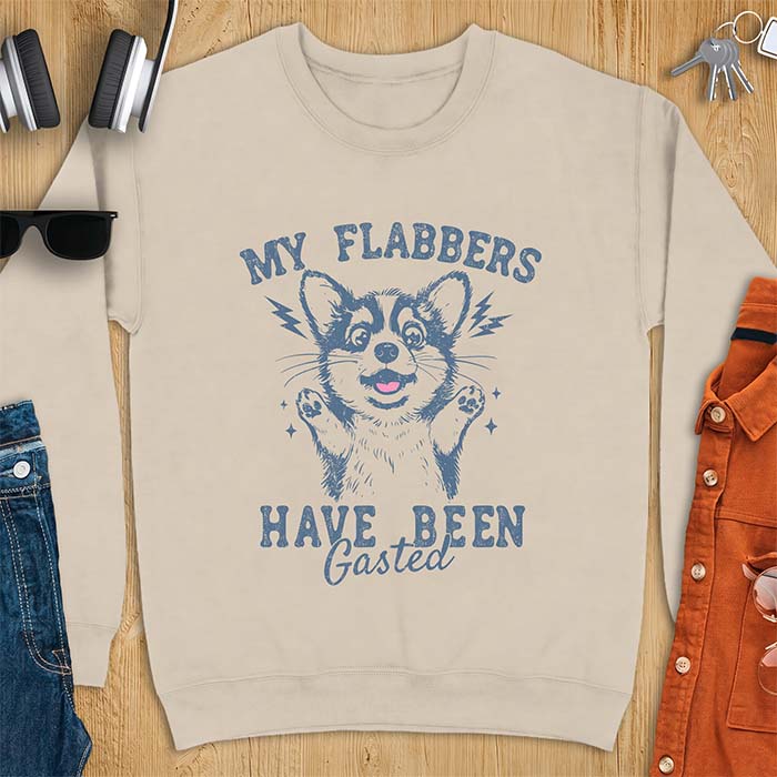 Sand sweatshirt with a corgi illustration, paws raised in shock, mouth open in a gasp, lightning bolts beside its ears, and the text My Flabbers Have Been Gasted