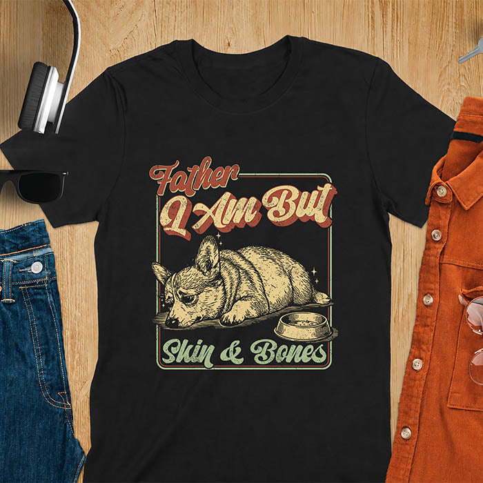 Black tee with corgi retro vintage graphic, empty bowl illustration and "Father I Am But Skin & Bones" text