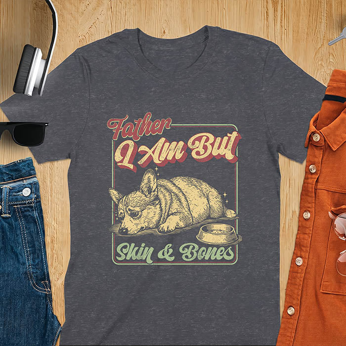Dark heather tee with corgi retro vintage graphic, empty bowl illustration and "Father I Am But Skin & Bones" text