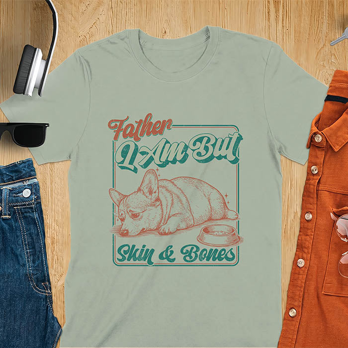 Sage Green tee with corgi retro vintage graphic, empty bowl illustration and "Father I Am But Skin & Bones" text