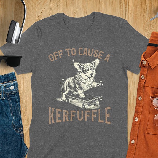 Dark heather t-shirt with Off To Cause A Kerfuffle text and cute corgi puppy attempting skateboarding illustration