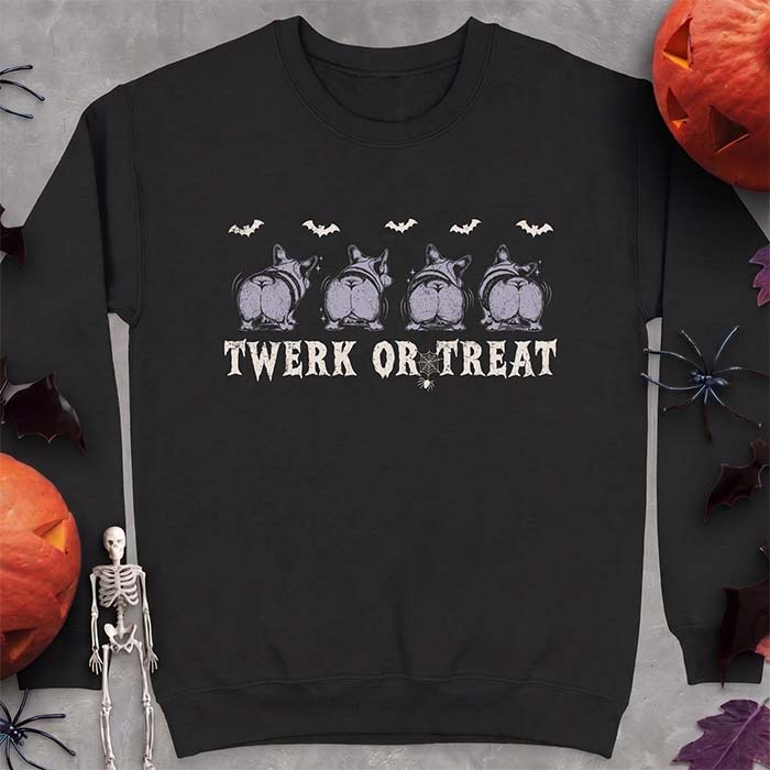 Black sweatshirt with a Halloween graphic of four Corgis viewed from behind shaking their rumps, bats flying above and a spider on a web, with the text Twerk Or Treat